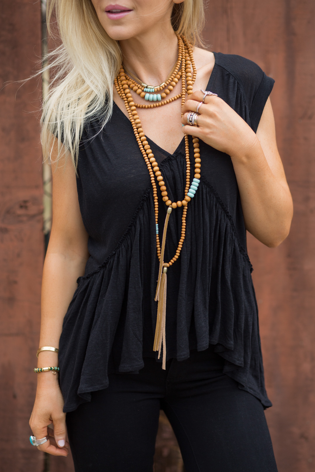 Lisa Allen of Lunchpails and Lipstick wearing all black Free People with wooden and turquoise beaded necklace