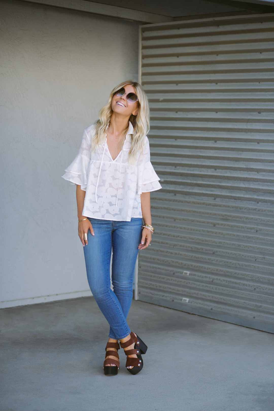 lisa allen of lunchpails and lipstick wearing a white for love and lemons top with madewell denim and prada platforms in Encinitas, CA