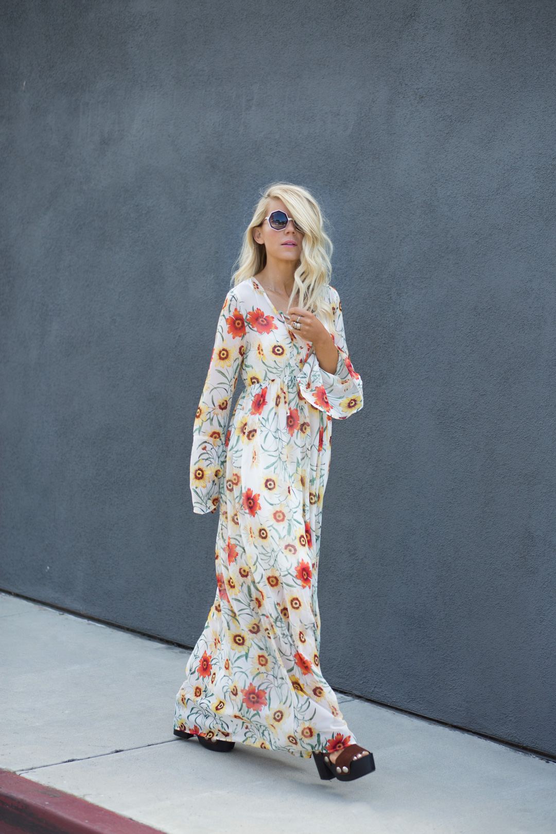 lisa allen of lunchpails and lipstick wearing a floral maxi dress from wildfox with wooden platforms by prada and Raen sunglasses in Encinitas CA 
