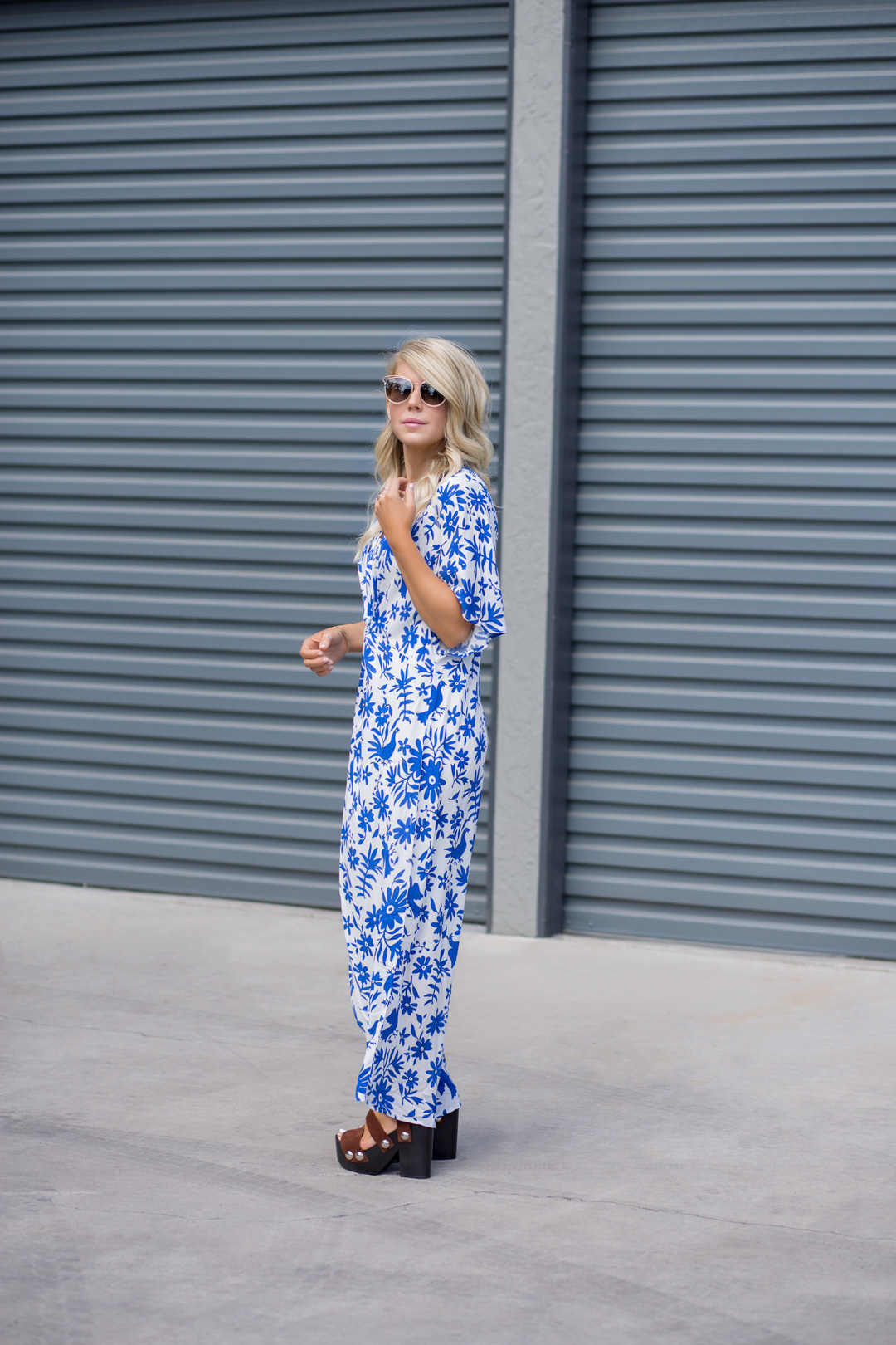 Lisa Allen of Lunchpails and Lipstick wearing a blue and white Show Me Your Mumu twist front dress and Alexander Wang Platforms with Dior Gold Sunglasses 
