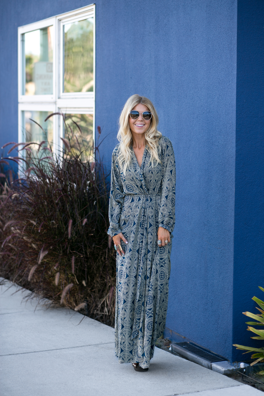 Lisa Allen of LunchPails and Lipstick wearing a green patterned print kaftan from Anthropologie with Dior shades and Alexander Wang platforms 