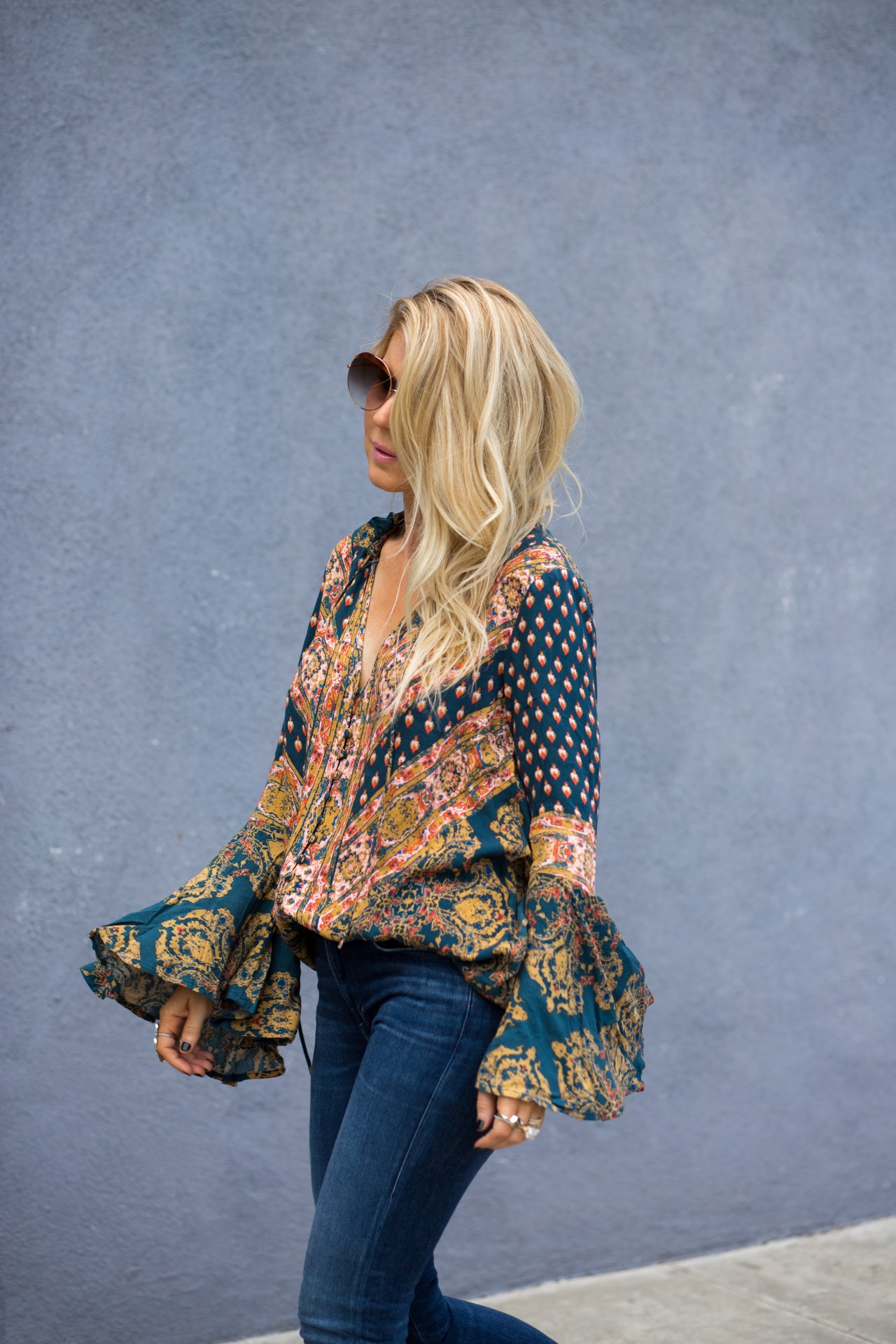 Lisa Allen of Lunchpails and Lipstick wearing a free people floral tunic with citizen of humanity jeans and chanel loafers