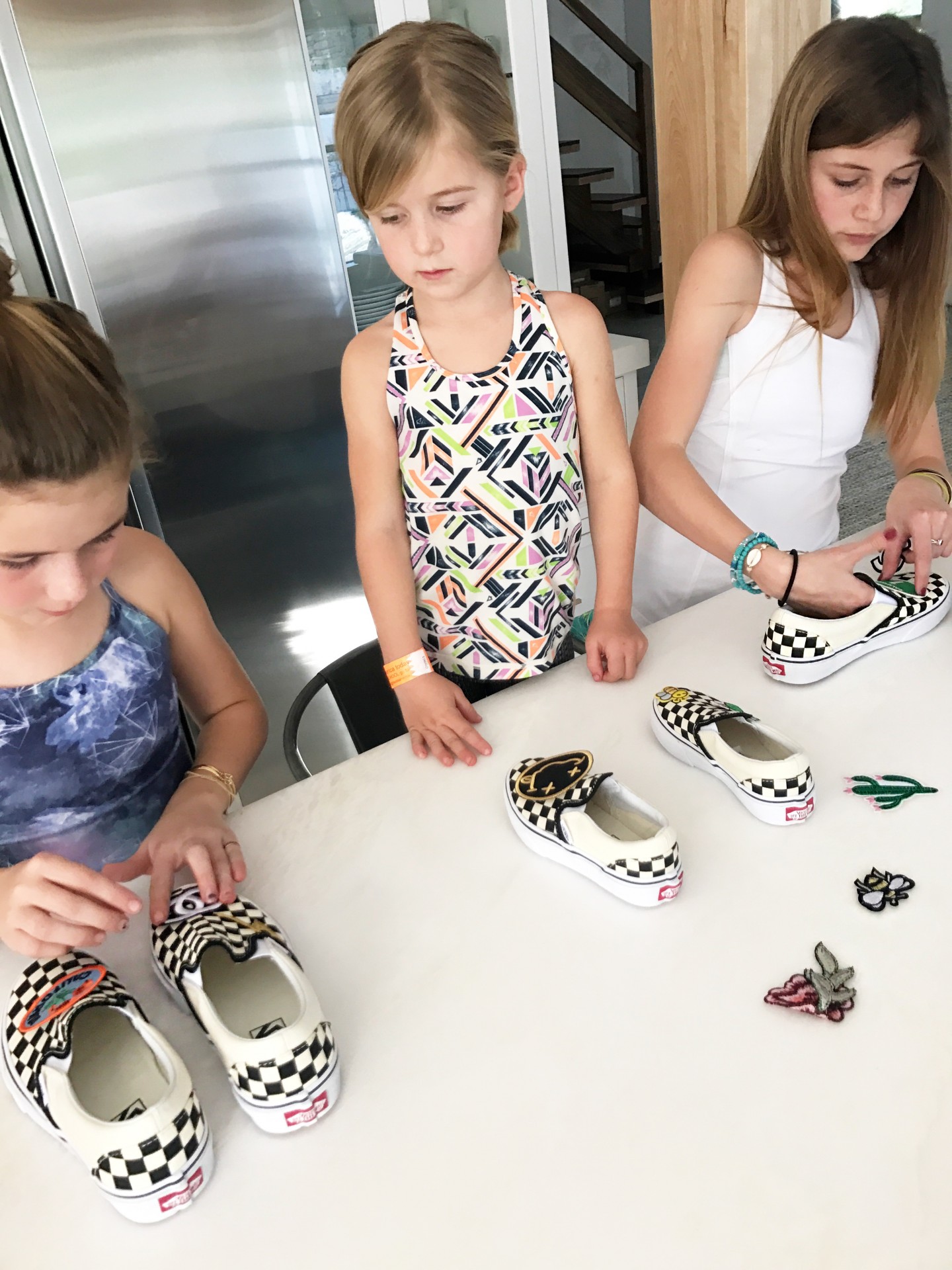 Lisa Allen and kids create a DIY design of their shoes with Vans by using patches