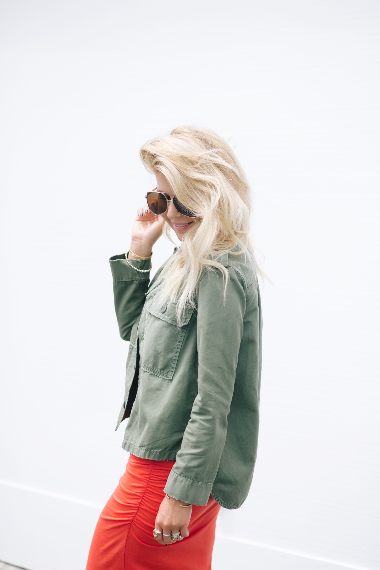Lisa Allen of Lunchpails and Lipstick wearing a AMO army green jacket and grey ant sunglasses from Shopbop 