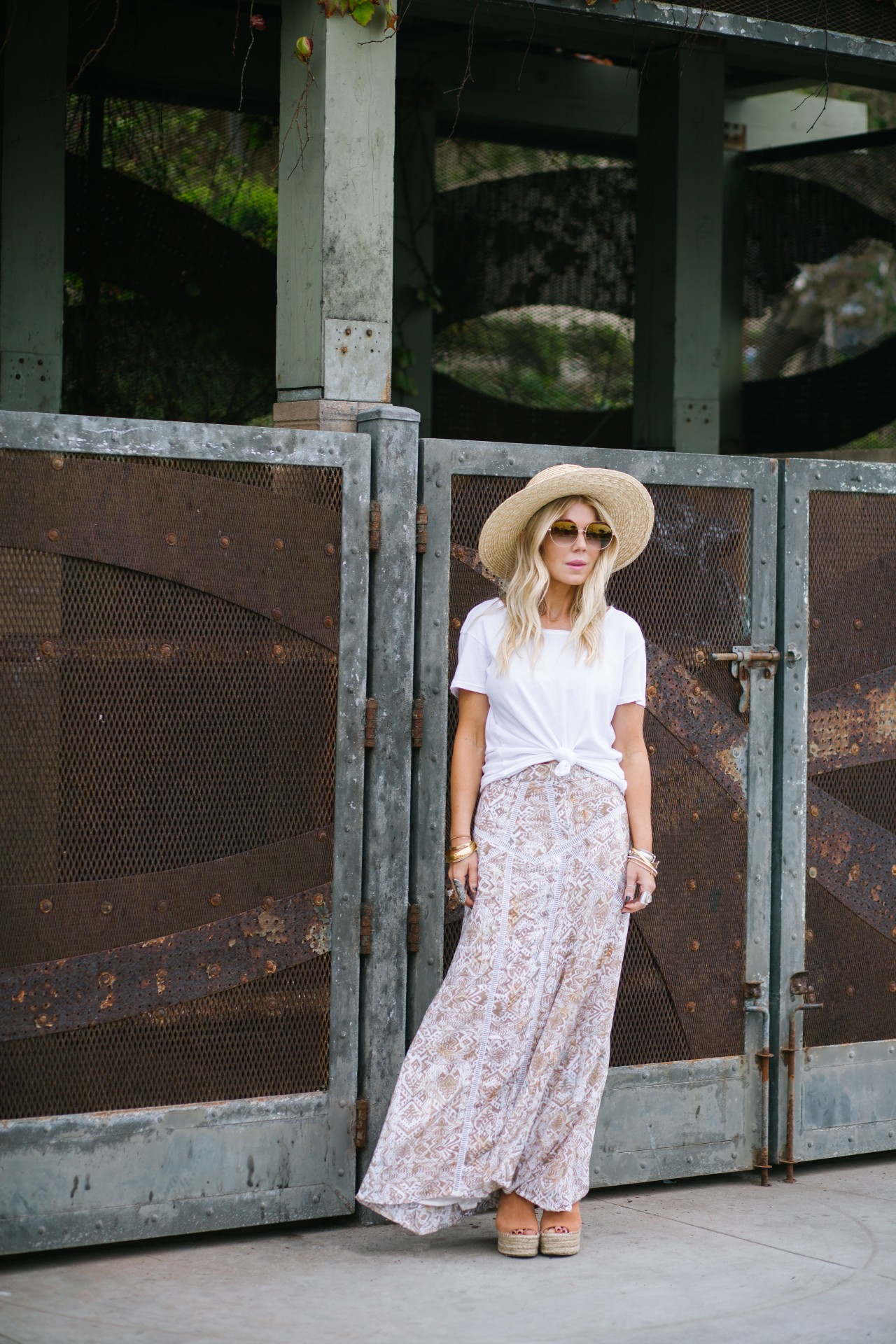 Lisa Allen of LunchPails and Lipstick wearing a maxi skirt from Cleobella and a white tee with a straw hat from Topshop and Chloe wedges in Solana Beach, CA. 