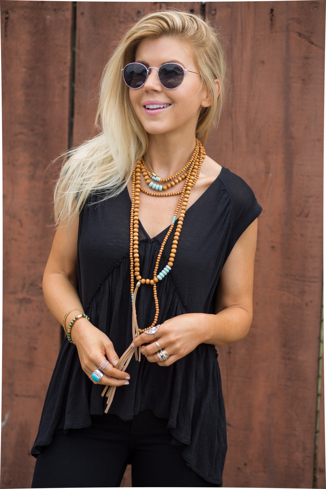 Lisa Allen of Lunchpails and Lipstick wearing all black Free People with wooden and turquoise beaded necklace