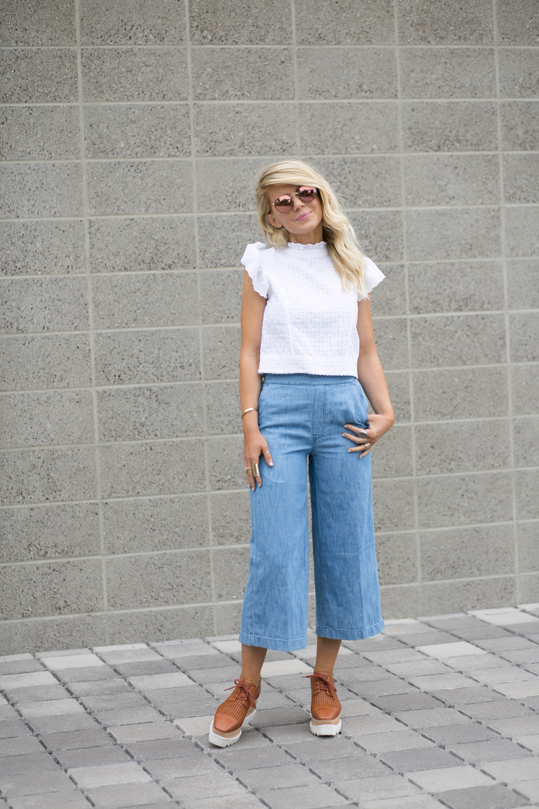 lisa allen of lunchpails and lipstick wearing cropped chambray pants and a white eyelet top with stella mccartney platforms