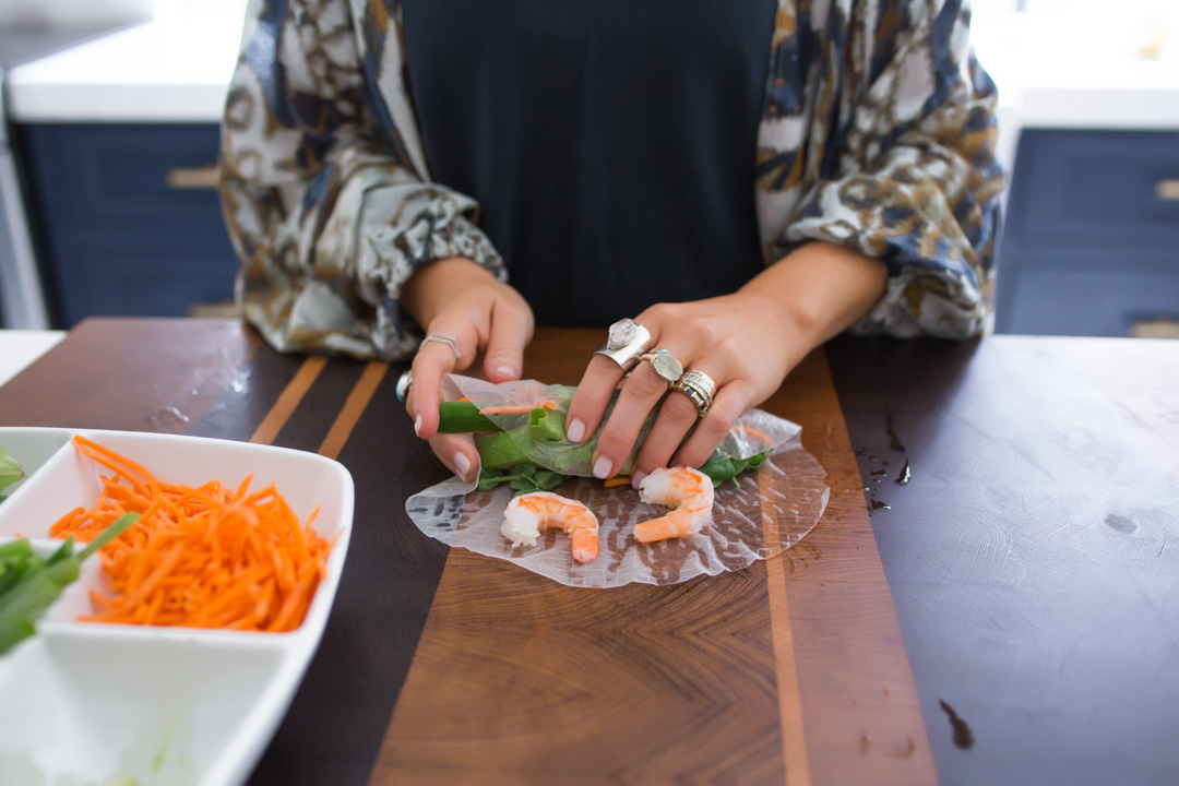 Lisa Allen of Lunchpails and Lipstick making Vietnamese Spring Rolls in her kitchen in Encinitas CA 