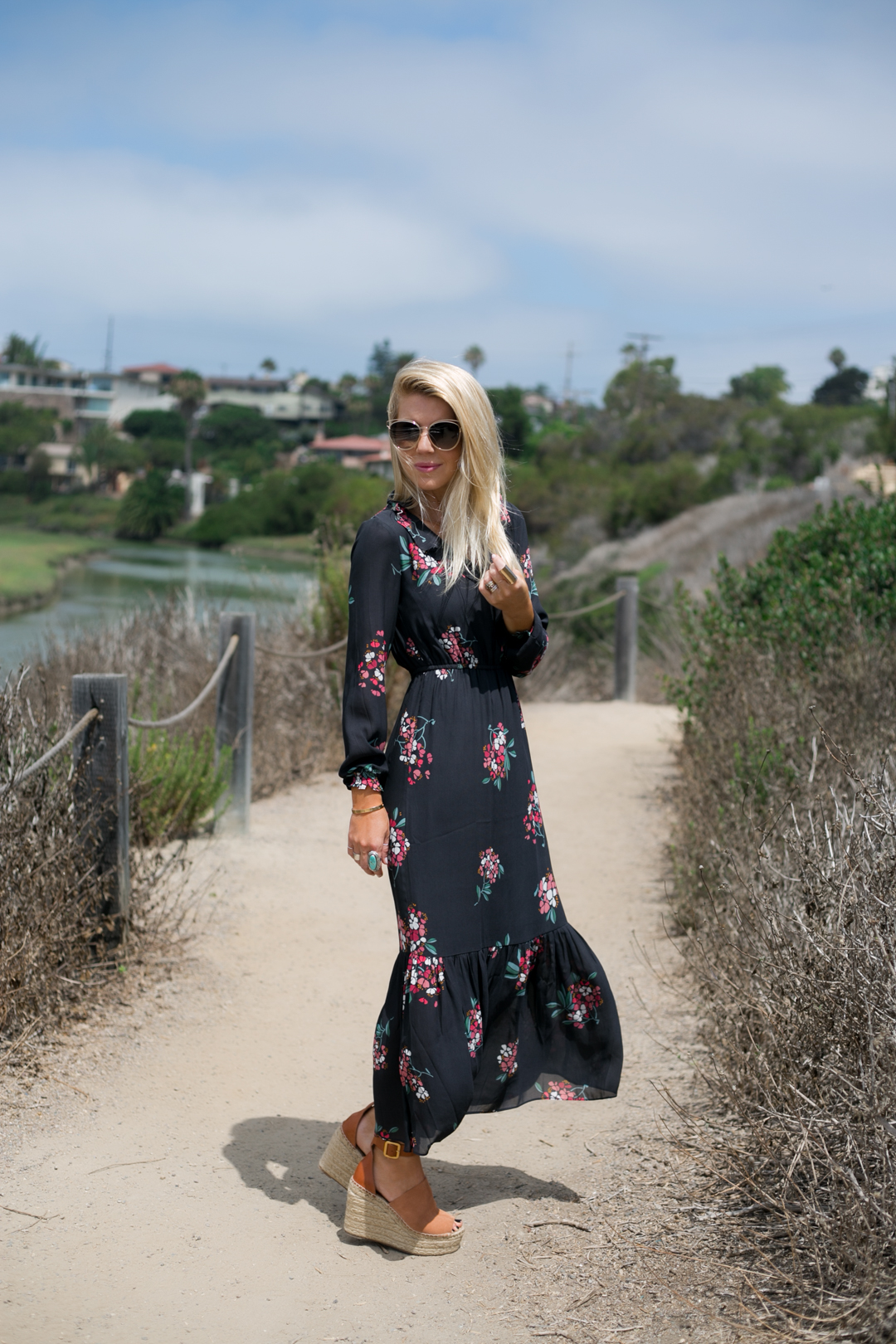 Lisa Allen of LunchPails and Lipstick wearing a long floral maxi dress from the LOFT with Dior Sunglasses and Chloe wedges in Solana Beach, CA