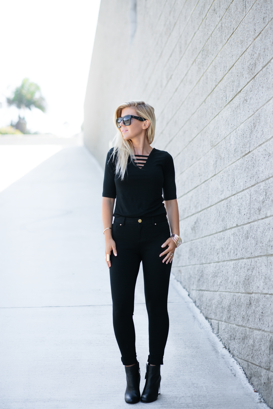 Lisa Allen of LunchPails and Lipstick wearing an all black outfit from INC Macy's 