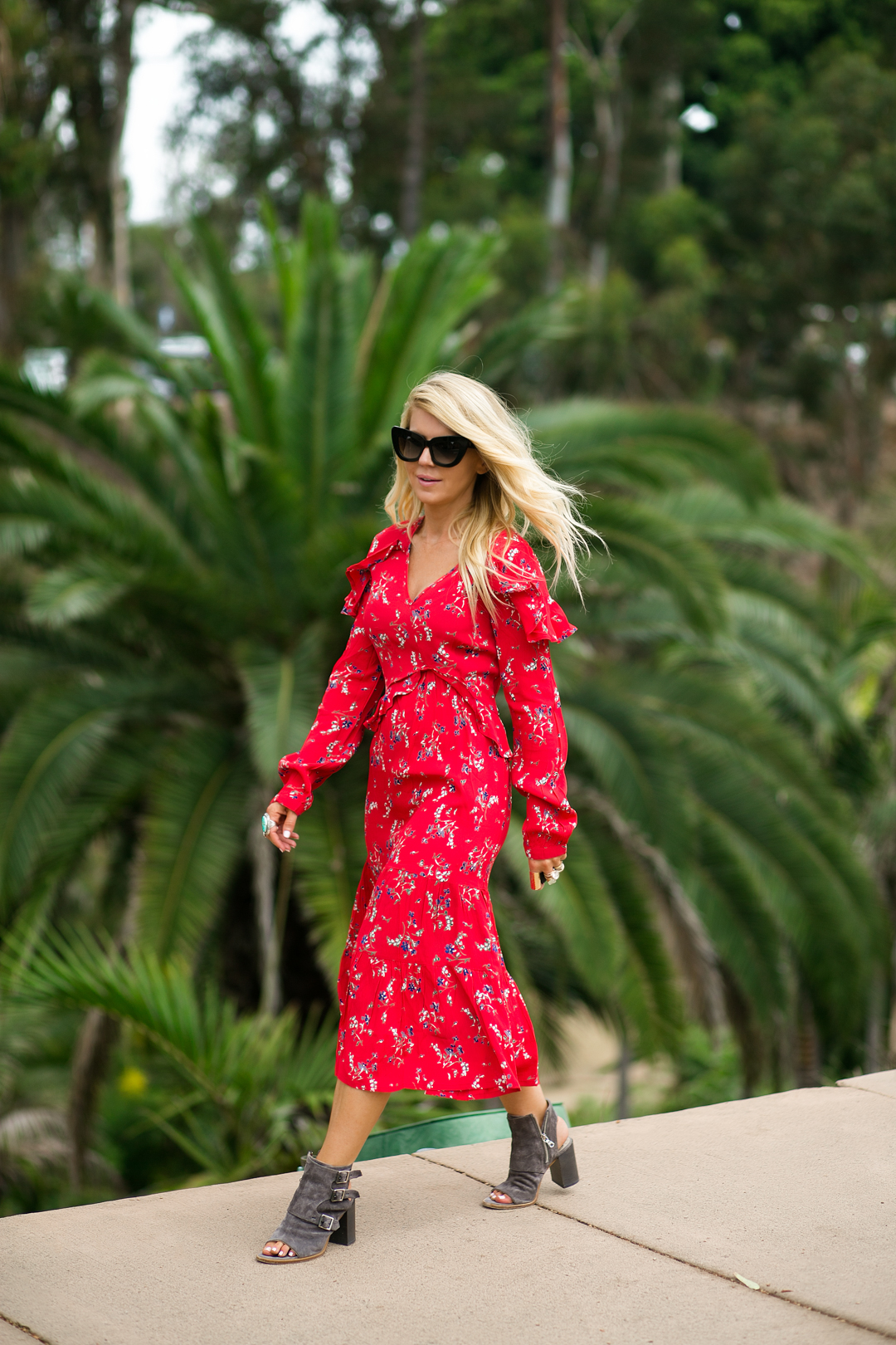 Lisa Allen of Lunchpails and Lipstick wearing a red floral dress from ASOS with Rag and Bone sandals and Valley eyewear