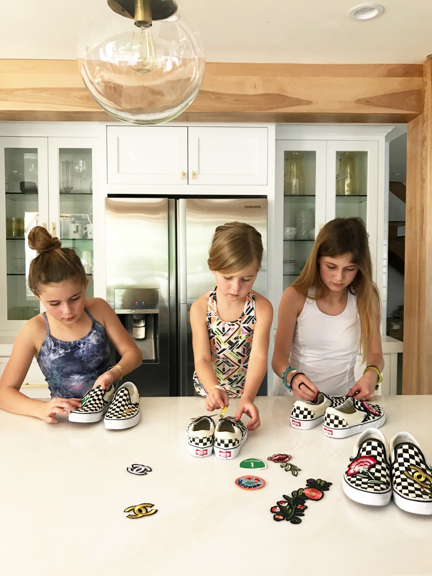 Lisa Allen and kids create a DIY design of their shoes with Vans by using patches